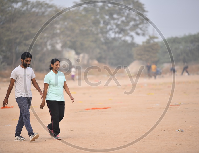 A couple walking as a part of morning exercise.