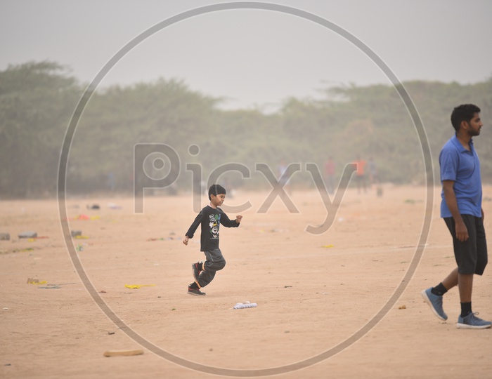 A little boy jogging as a part of morning exercise.