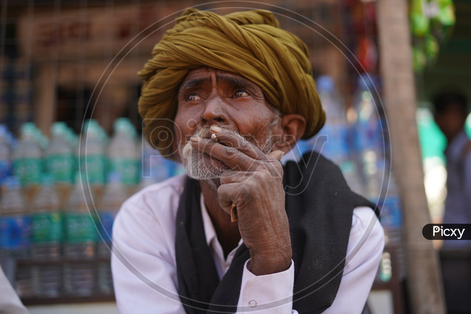 Potrait Of a old man in Pushkar Fair Smoking a Beedi