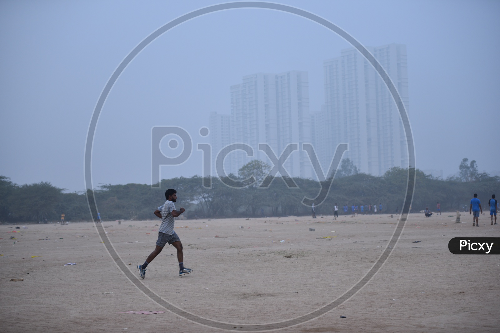 A man jogging in grounds as a part of morning exercise.