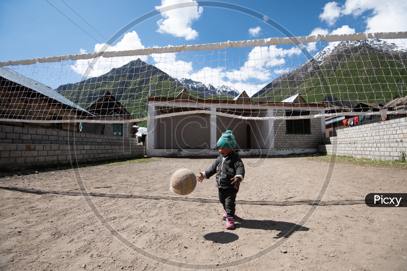 Cute little kid playing with Volley Ball
