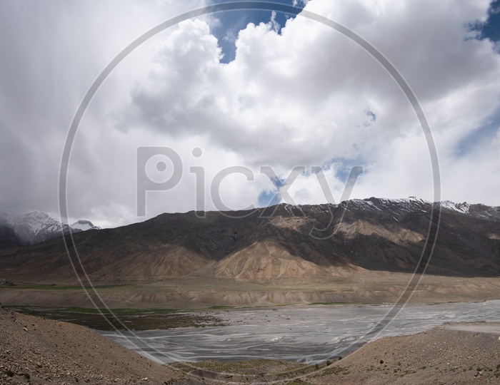 Beautiful Landscape of Snow Capped Mountains with Clouds, Spiti Valley