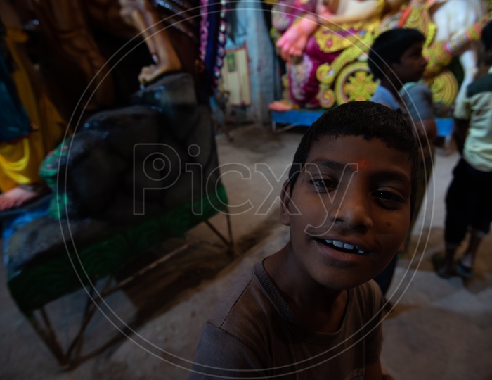an Indian Boy at The Ganesh making Area Taken a Closeup Shot
