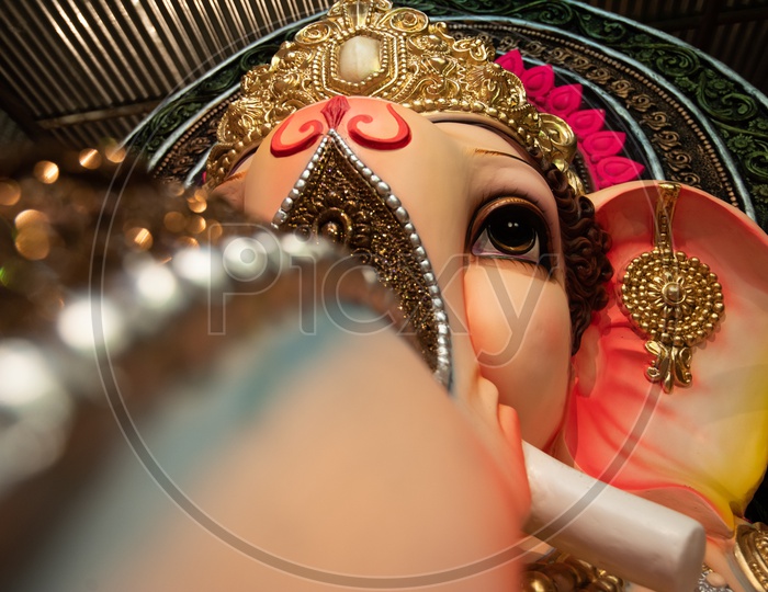 Indian Hindu God Ganesh idol Closeup Shot Presenting The Eye and Trunk Of Elephant Headed God