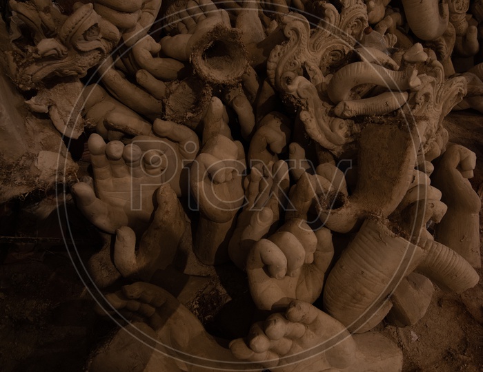 A Part of Ganesh Idols Made Of Plaster of Paris Situated Arbitrarily Closeup Shot