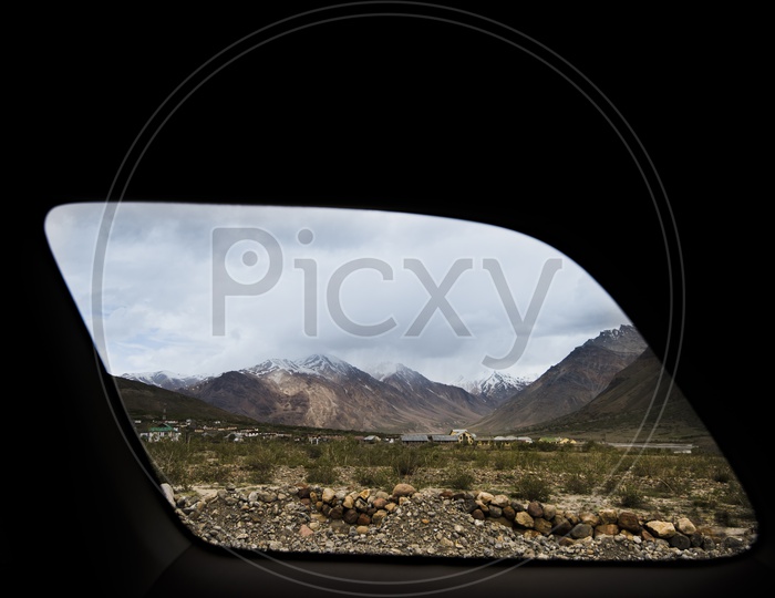 Spiti Valley mountains through a car window