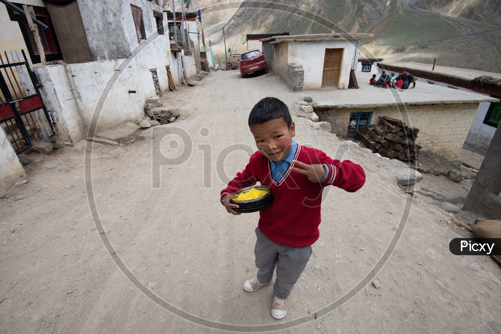 A School boy With His Lunch Plate and Posing For Photo