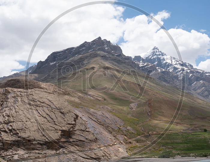 Beautiful Snow capped mountains of Spiti Valley with Greenery in the foreground