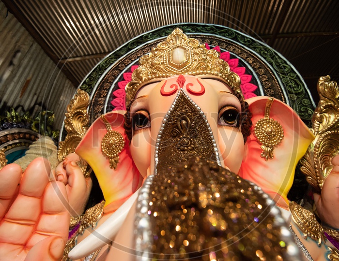 Indian Hindu God Ganesh idol Closeup Shot Presenting The Eye and Trunk Of Elephant Headed God