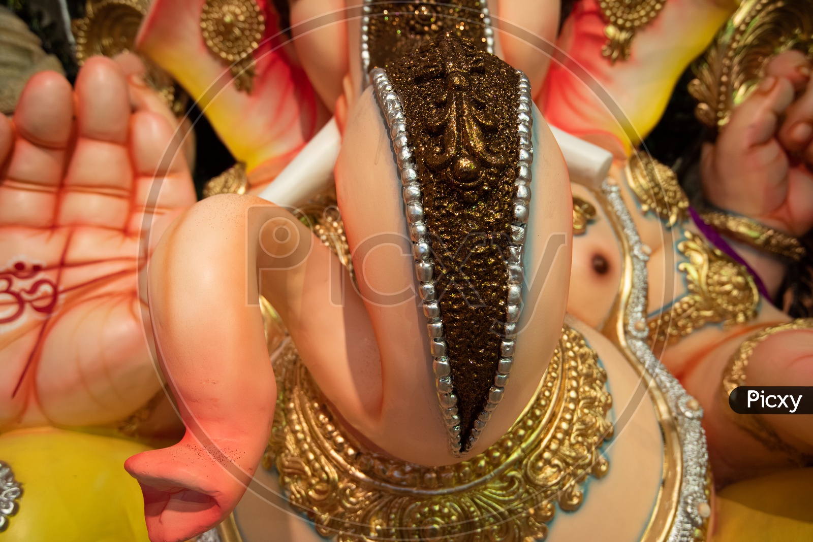 Indian Hindu God Ganesh idol Closeup Shot Presenting The Trunk Of Elephant Headed God