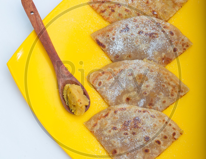 Indian  Aloo Paratha in a Plate Presentation Composition shot With White Background