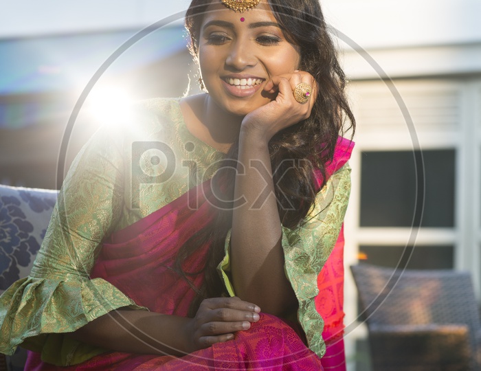 Indian smiling Female Model in Saree with Jewellery