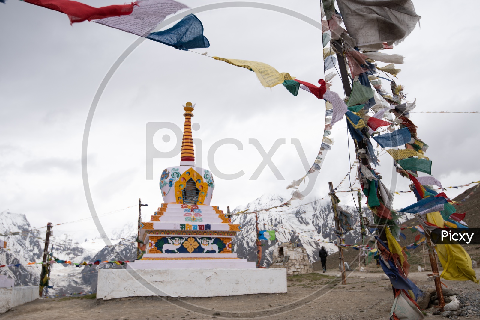 Tibetan Temple with Colorful tibetan Flags  with Mountains in Background