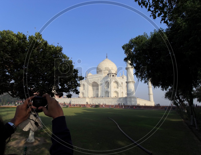 Photographer clicking Taj Mahal Taj Mahal