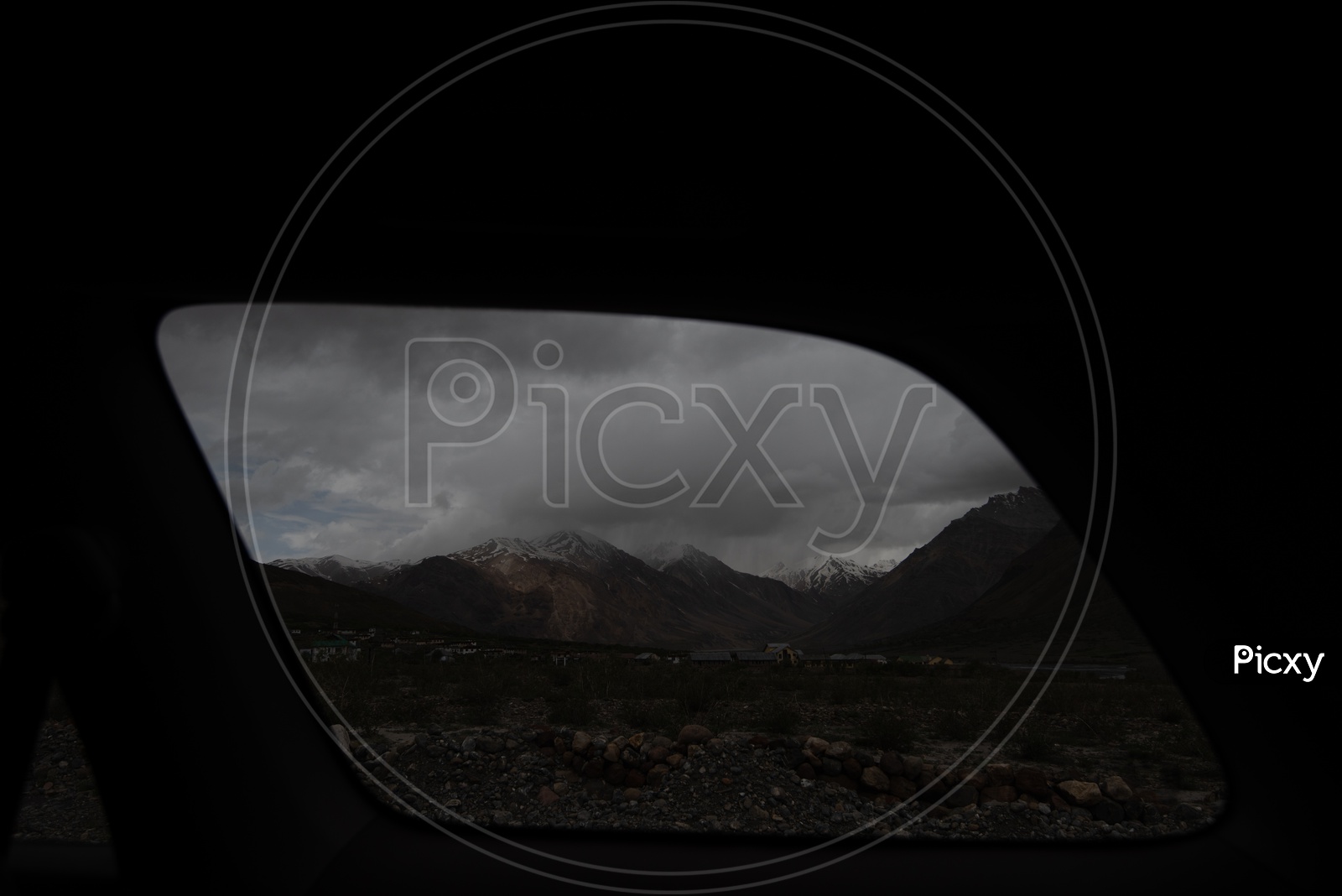 Beautiful Snow Capped Mountains of Spiti Valley  through a car window