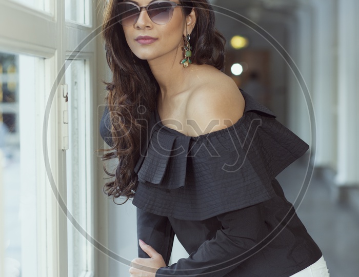 Young Indian Female Model in Modern Dress with Stylish Sun Glasses