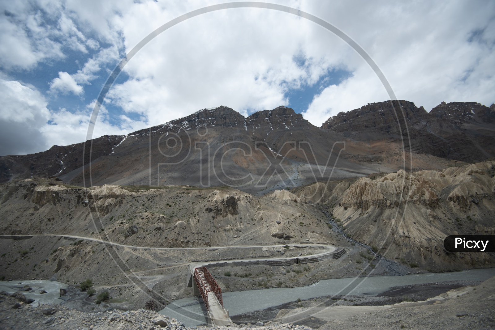 Beautiful Landscape of Snow Capped Mountains of Spiti Valley with roadways in the foreground