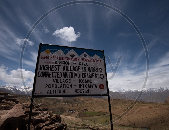 A Sign Board Saying the Worlds Highest Village