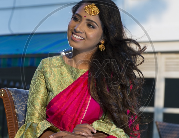 Indian smiling Female Model in Saree with Jewellery