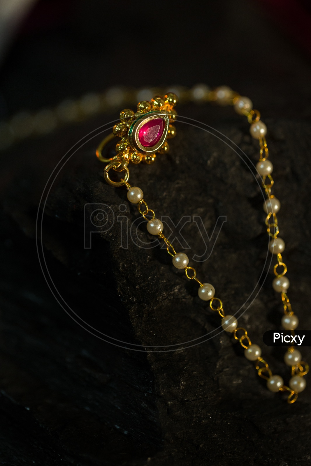 A Beautiful Indian Bridal Chain with Pearls and Gold Pendent Closeup Shot