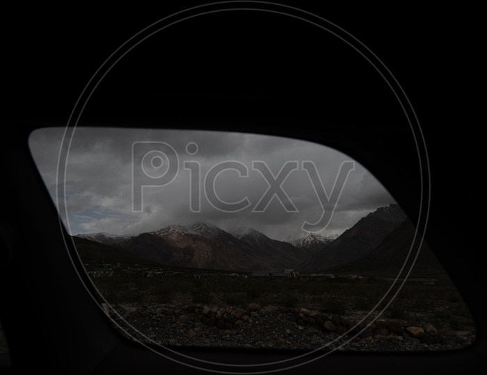Beautiful Snow Capped Mountains of Spiti Valley  through a car window