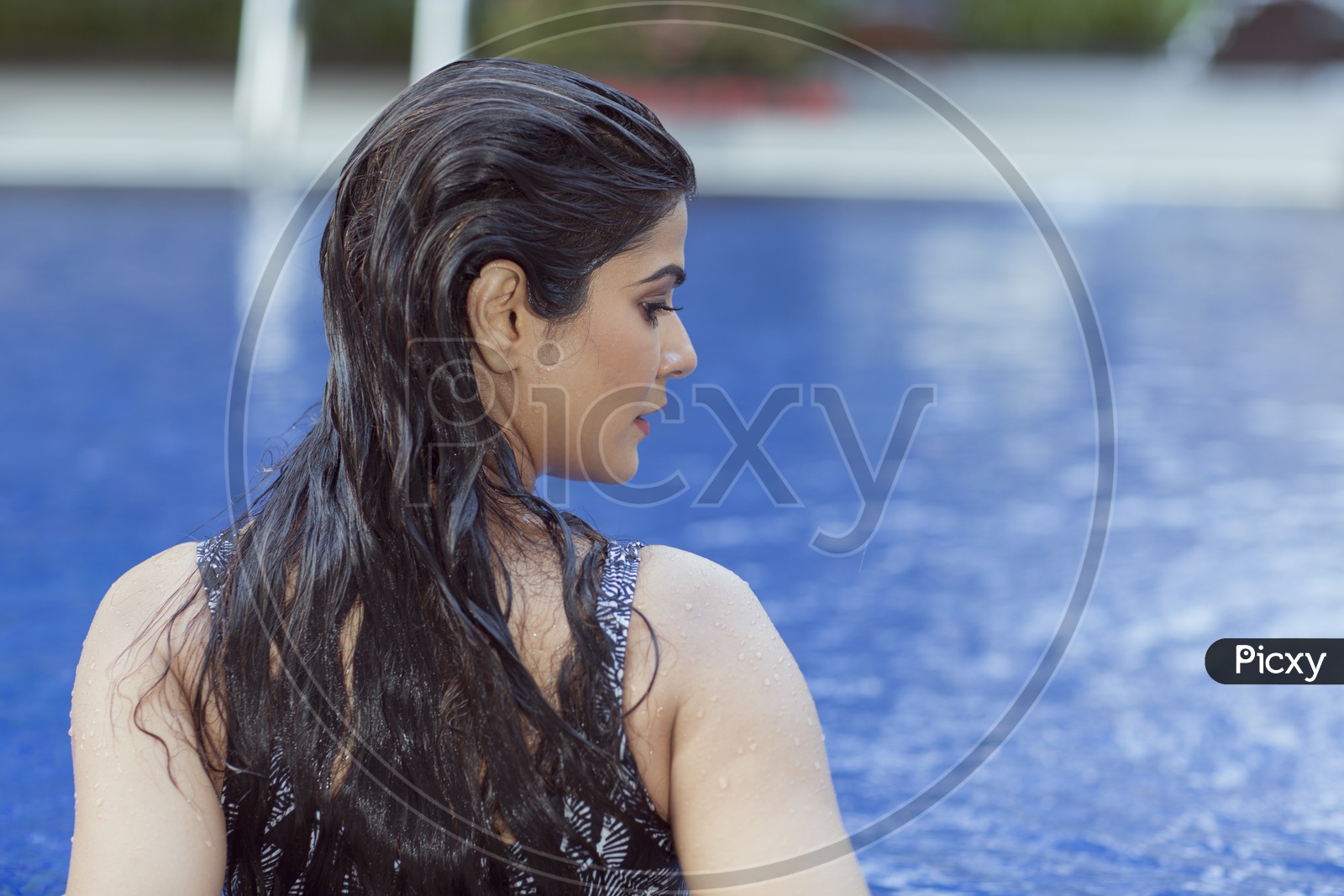 Indian Female Model in Swim suit near Swimming Pool