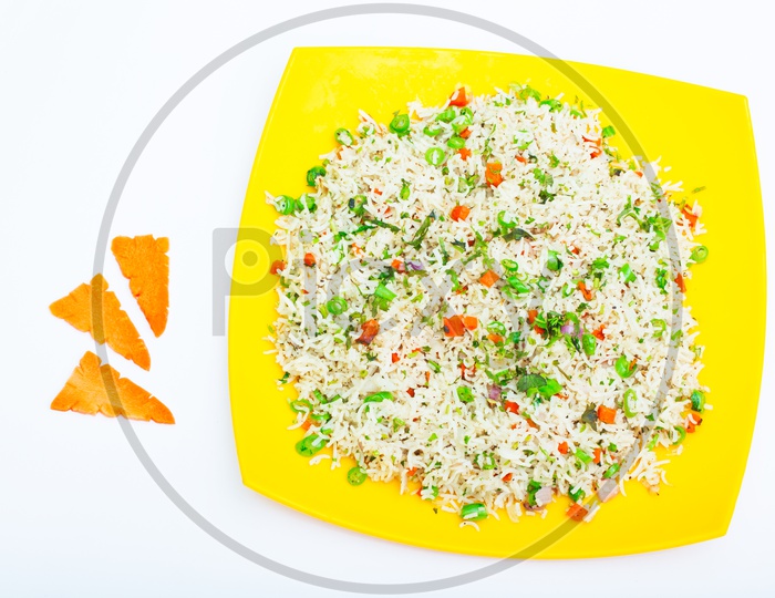 Indian Vegitable Fried Rice in a Plate Presentation Composition Shot With White Background