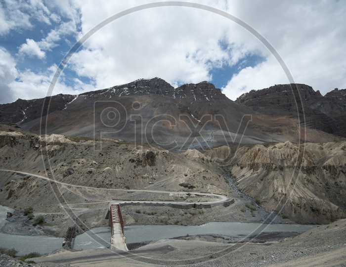 Beautiful Landscape of Snow Capped Mountains of Spiti Valley with roadways in the foreground