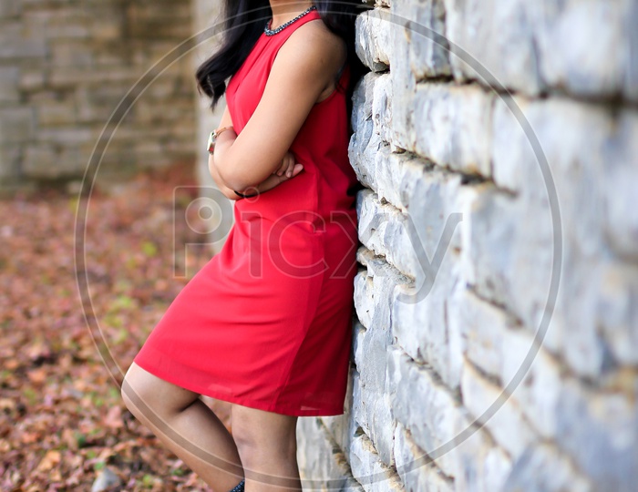 Female Model in red dress and Black boots - With blocked rock walk