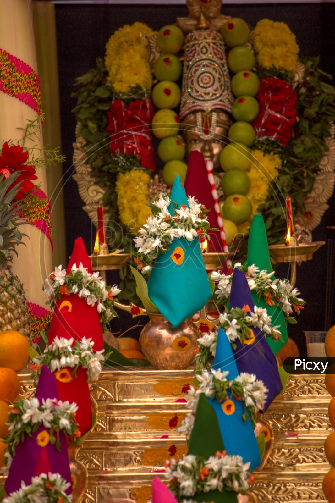 Image of Ayyappa Swami idol covered with fruits in Ayyappa Swami Pooja ...