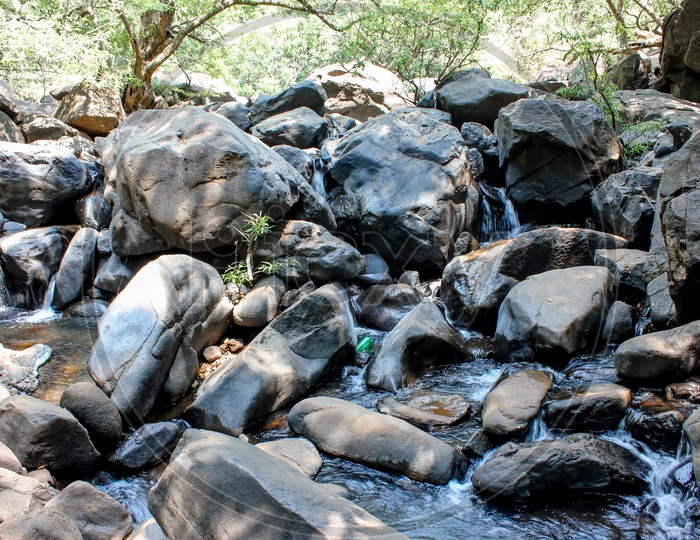 Water Flowing In Between The Stones in Goa Near Dudhsagar Falls