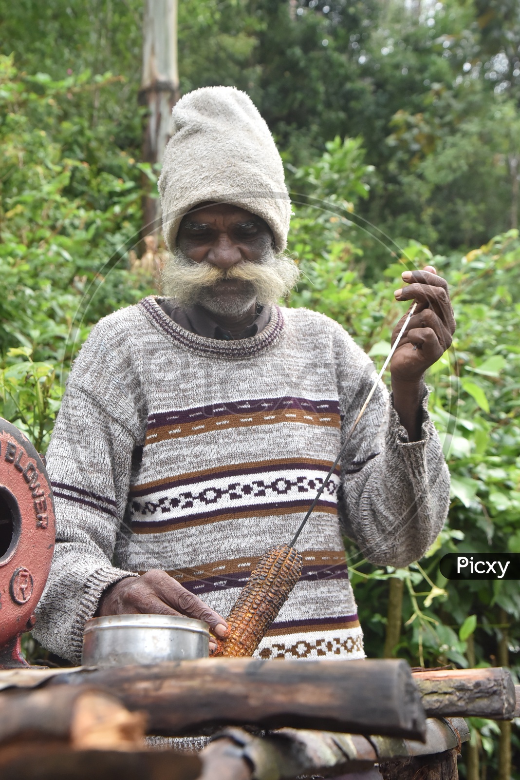Old man Selling Corn in Munnar Tea Plantations