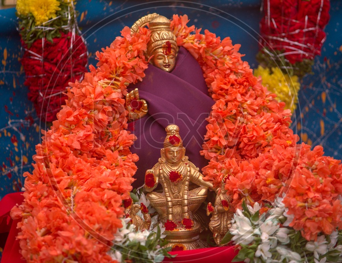 ayyappa swami pooja / Ayyappa Swamy idol covered with flowers
