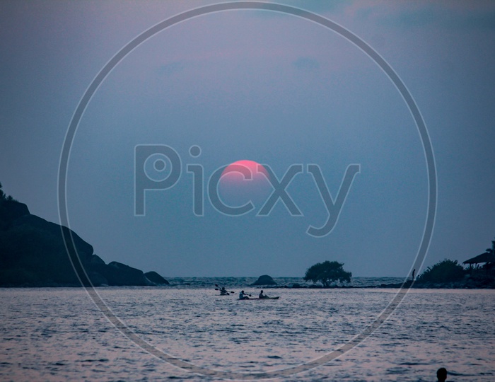 Sailing Boats  in Sea Water Silhouette and a Beautiful Sun in Background