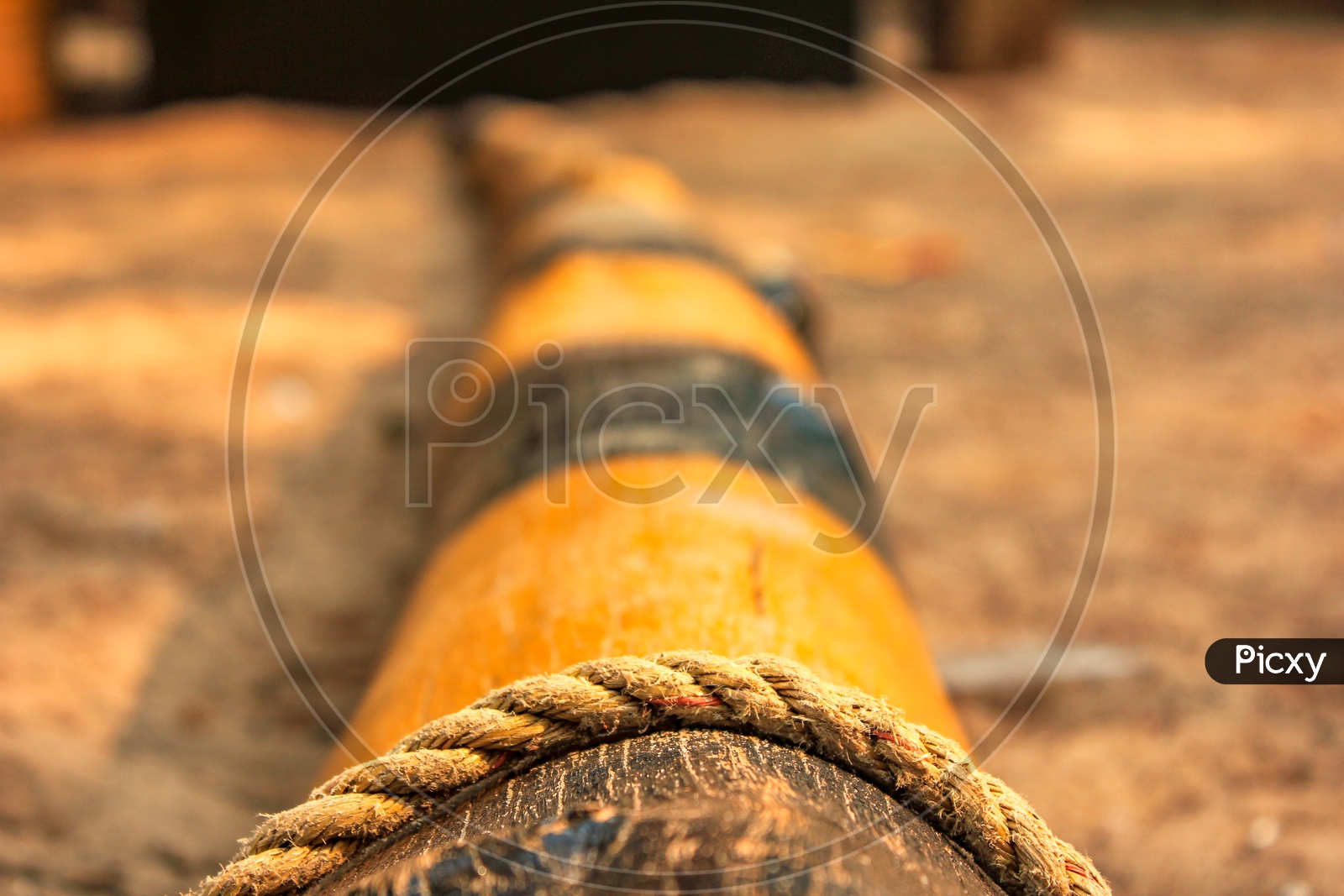 Image of A Thread Knotted To a Wood Log Closeup Shot-SO007644-Picxy