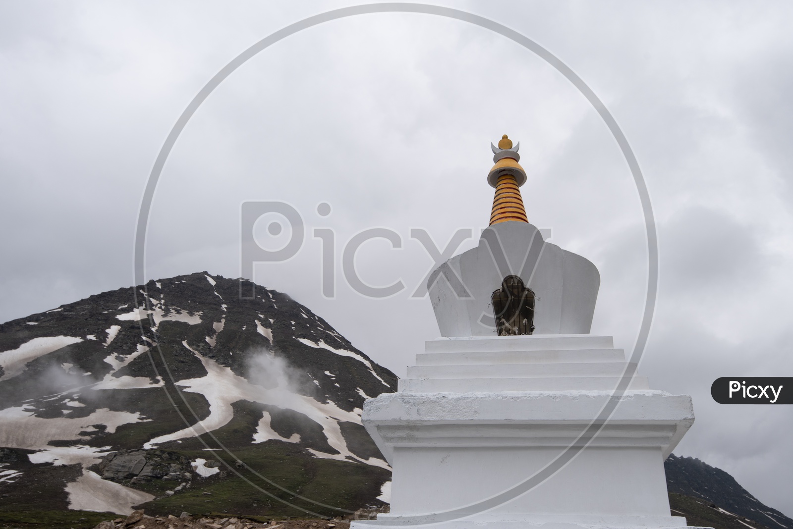 Stupas By Tibetans in Valleys Of Leh / Ladakh With Mountains In Background