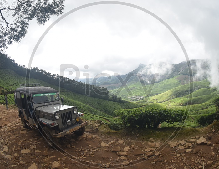 Beautiful Mountains of Munnar and car in the foreground
