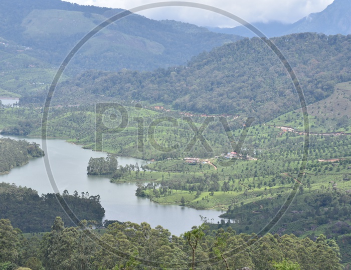 Beautiful Landscape of Munnar mountains with river flowing from the center