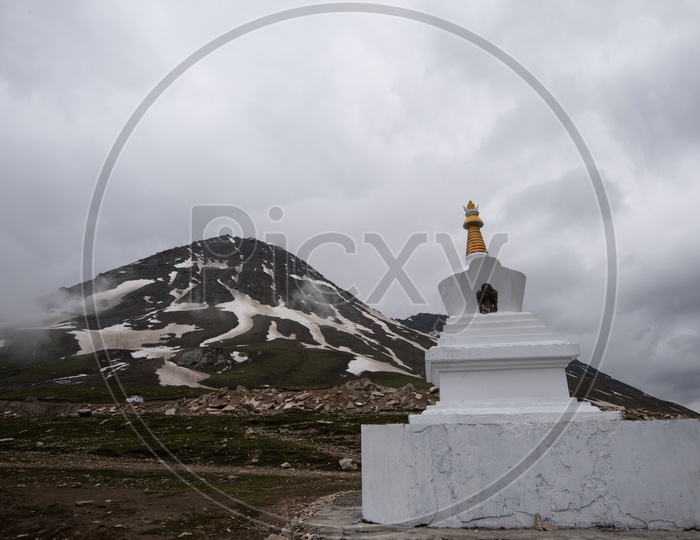 Stupas By Tibetans in Valleys Of Leh / Ladakh With Mountains In Background