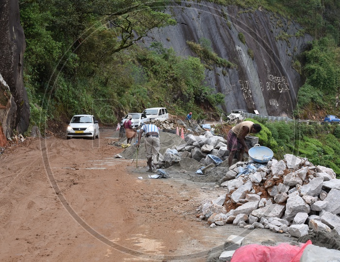 Vehicles Passing By a Road in Which Road Laying Work is Going on in Munnar
