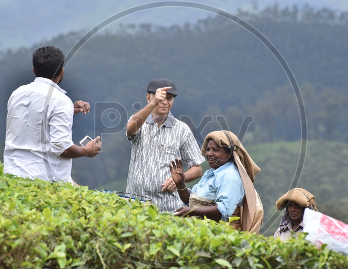 Tourists With The Local Tea Plantation Workers in Munnar