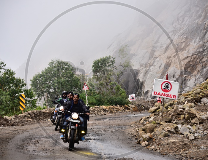 Bikers On Roads Of Munnar In Which Ganger Sign is Been Shown Besides The Road