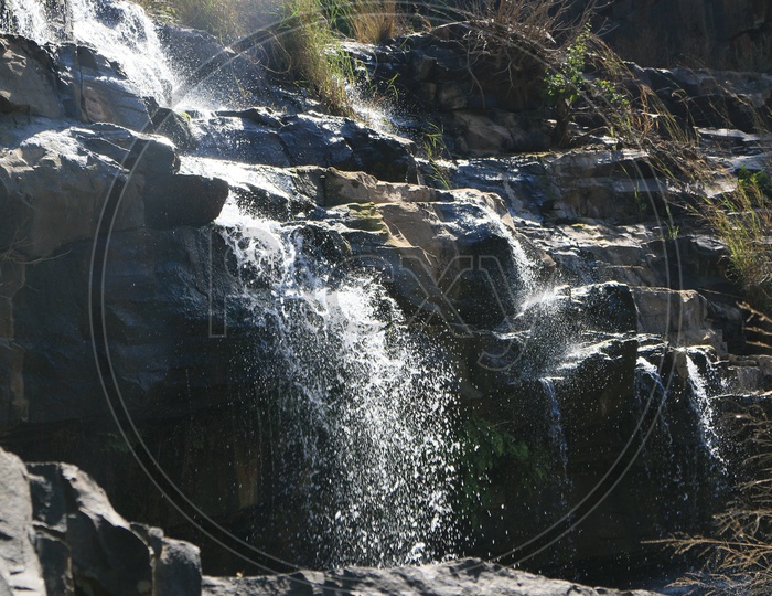 A  Small Water falls Falling From Stones Closeup Shot