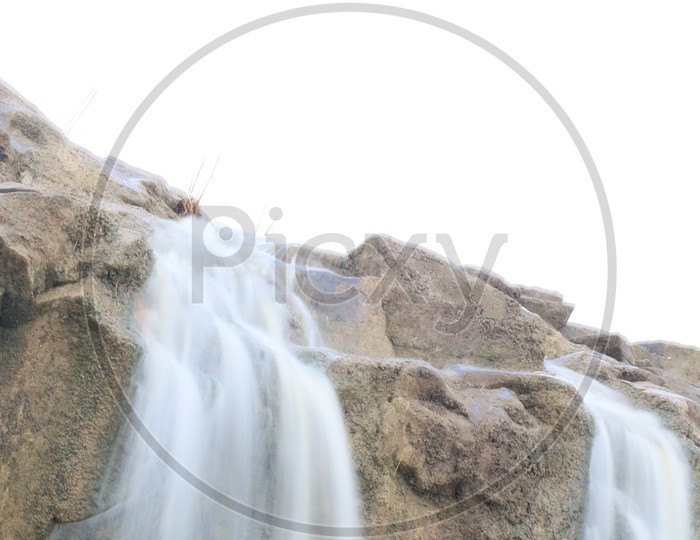 Water Flowing From top Of a Stone Hill Long exposure Shot