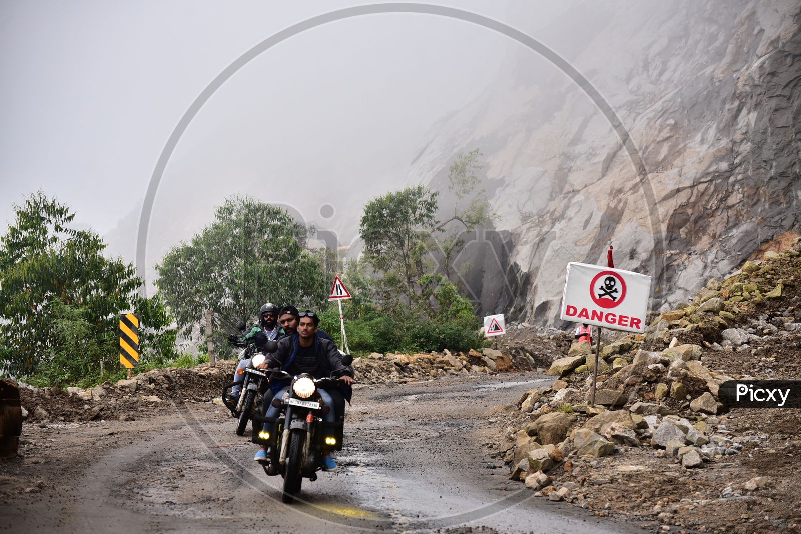 Bikers On Roads Of Munnar In Which Ganger Sign is Been Shown Besides The Road