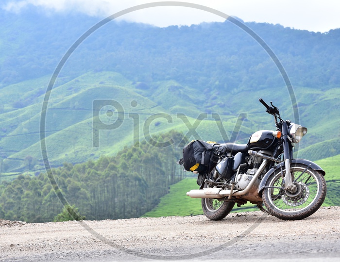 Royal Enfield Classic 350 bike with Munnar Mountains in the Background