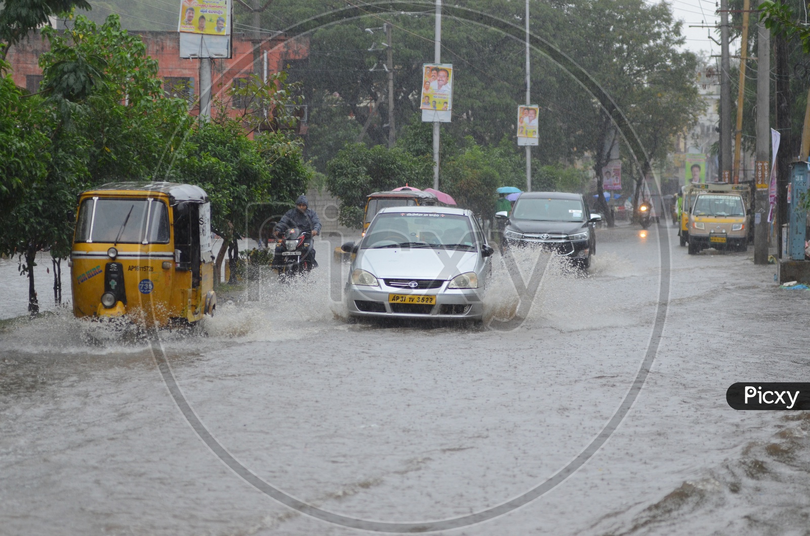 Cars in Water logged street, Cyclone Pedhai, Rain