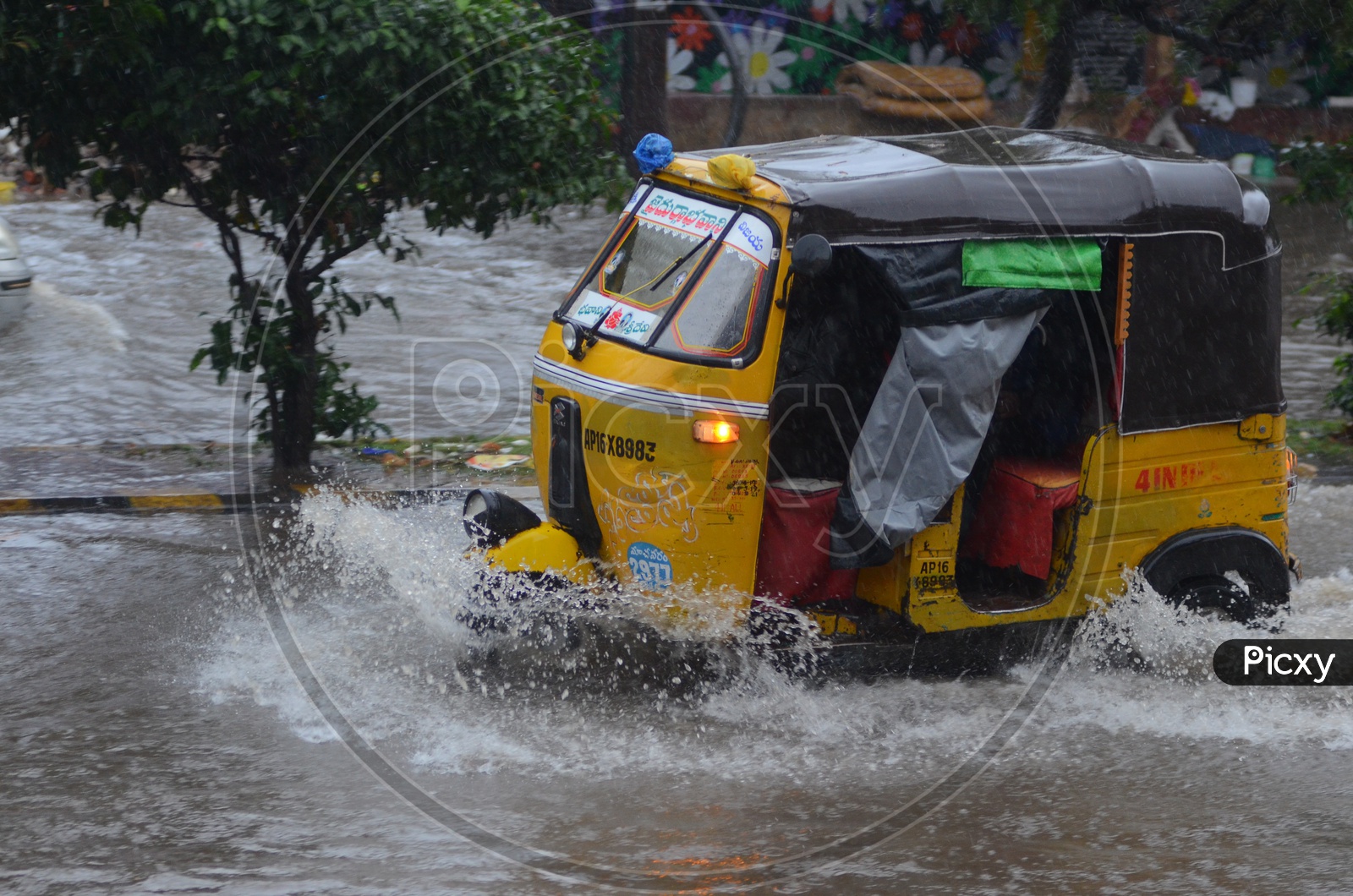 Auto in Water logged street, Cyclone Pedhai, Rain