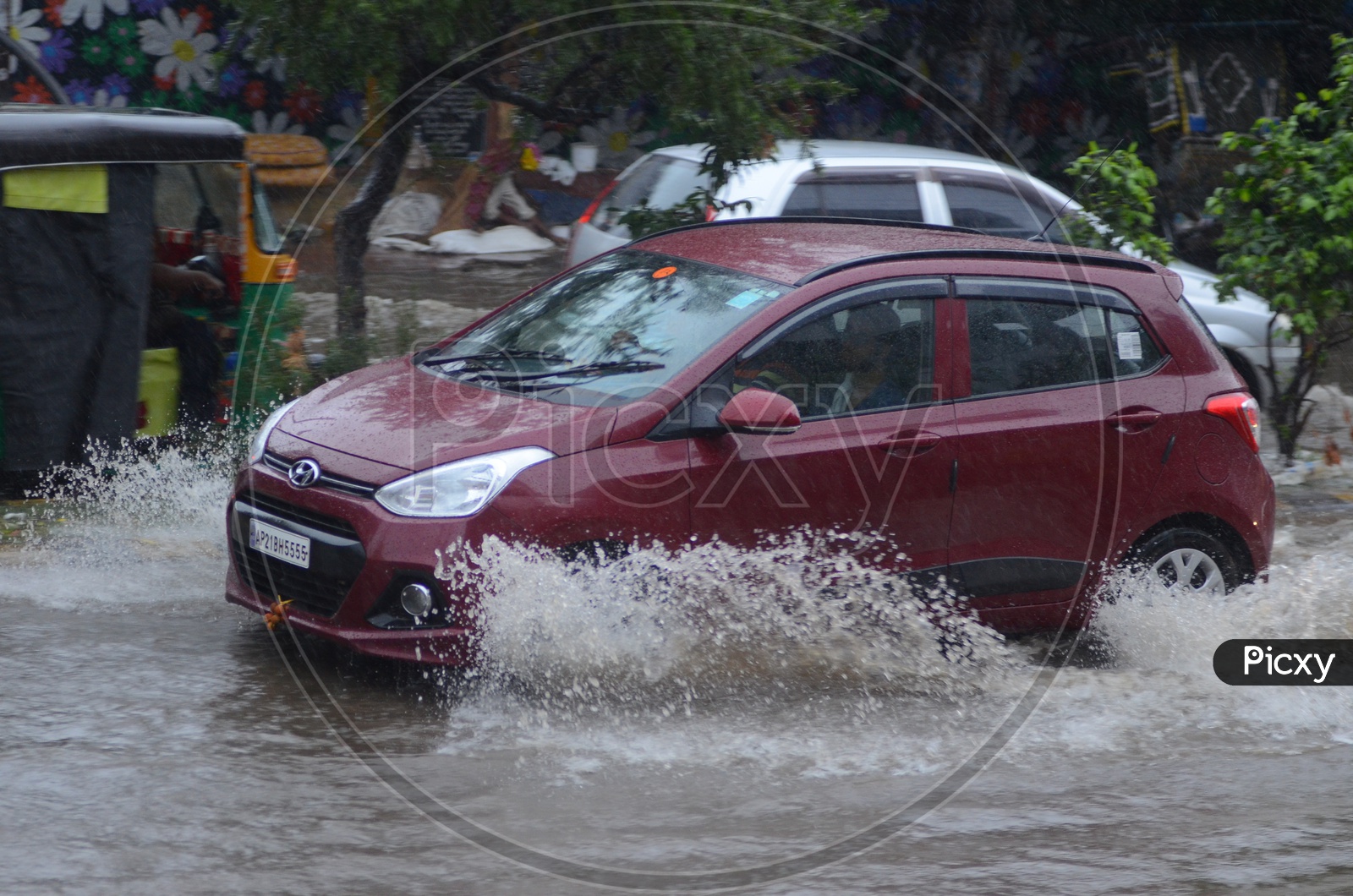 Car in Water logged street, Cyclone Pedhai, Rain