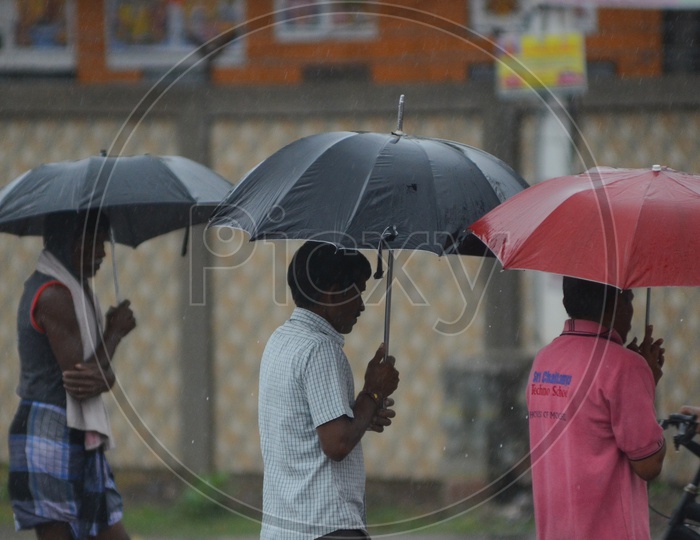 Men in Cyclone Pedhai, Rain